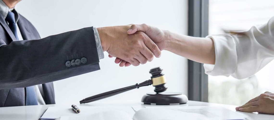 male-lawyer-and-business-woman-customer-handshake-2021-09-02-06-23-34-utc